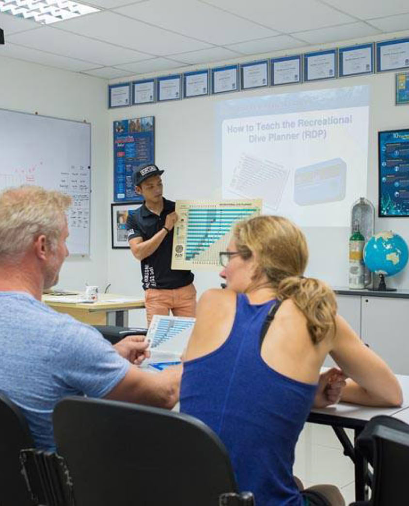 Grayscale image showcasing a vintage gas mask on display, emphasizing safety and protection themes.